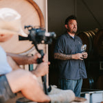 Kristopher Parker stands in the barrel room at Fess Parker Winery
